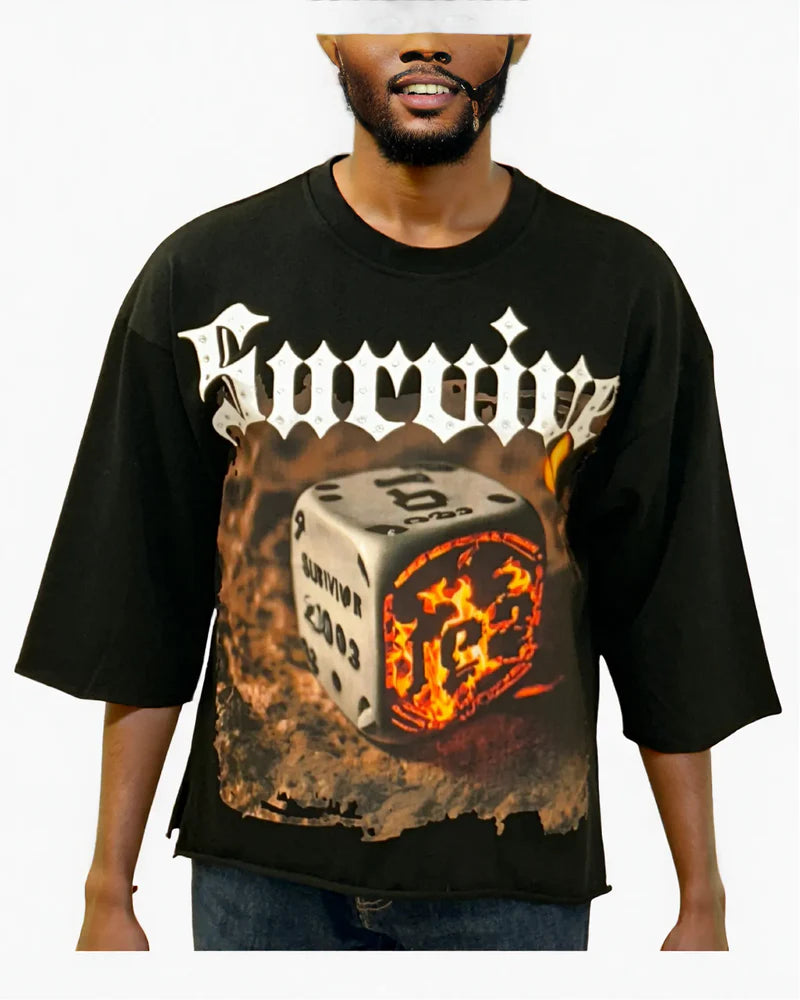 Black oversized cropped t-shirt featuring rhinestone embellishments on the front.