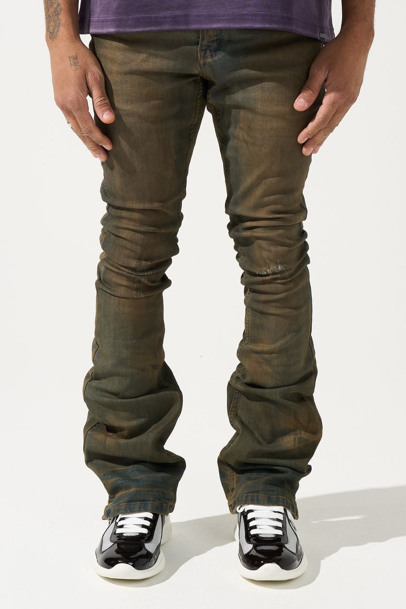 SERENEDE® OUD stacked jeans in dark denim with brown overdye, knee distressing, and signature stacked silhouette.