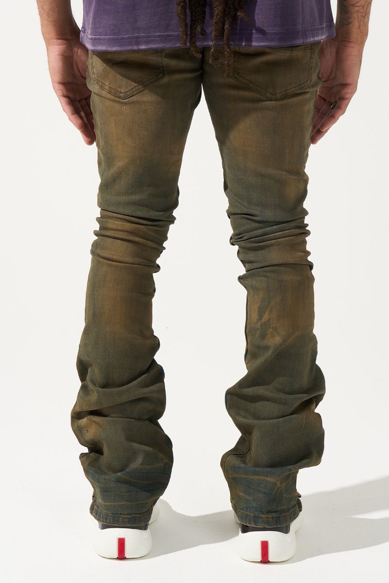 SERENEDE® OUD stacked jeans in dark denim with brown overdye, knee distressing, and signature stacked silhouette.