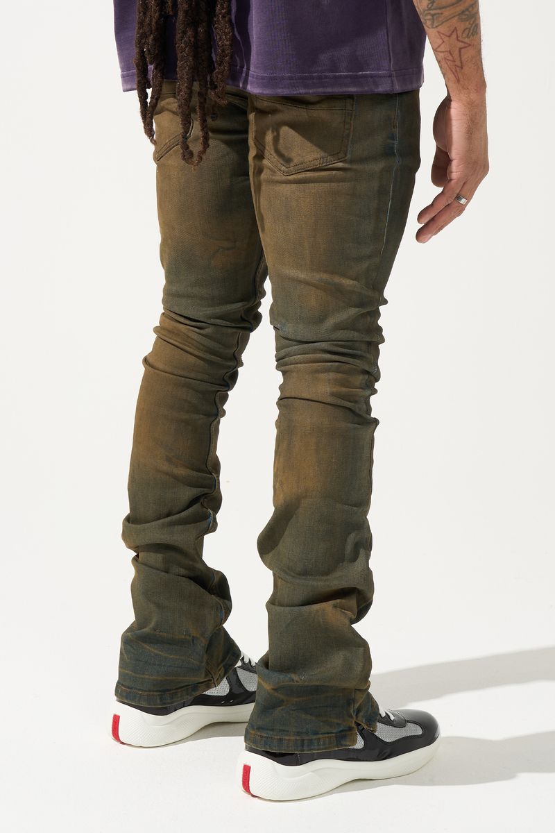SERENEDE® OUD stacked jeans in dark denim with brown overdye, knee distressing, and signature stacked silhouette.