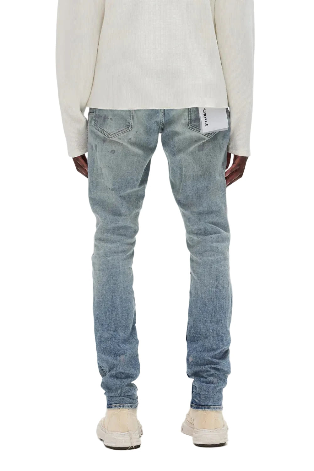 Purple-Brand Core White Label stretch skinny jeans with paint spots, abrasions, and signature hangtag.