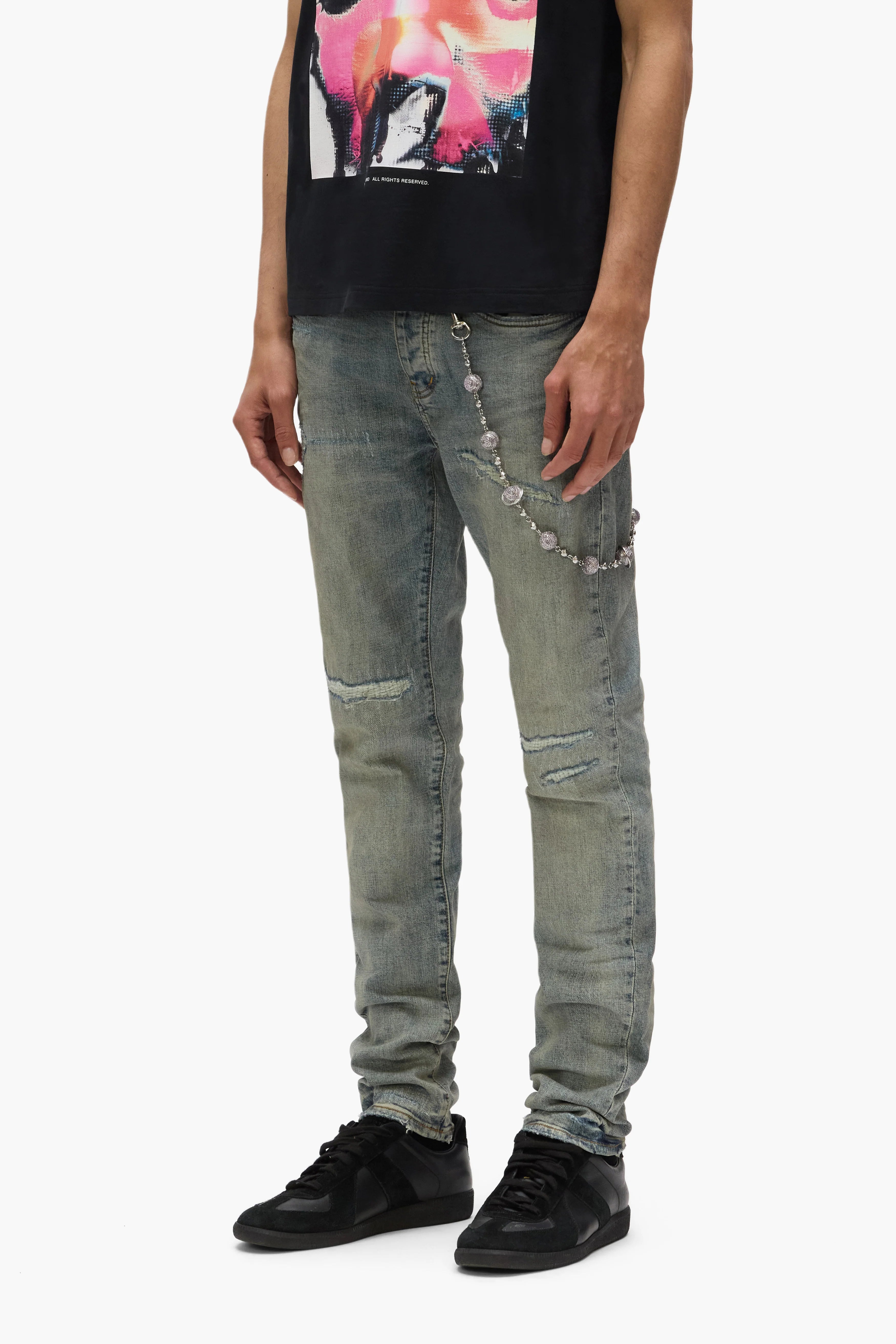Purple Brand Core White Label Light Indigo skinny jeans with abrasions, repairs, hand-finished washes, and branded leather patch, featuring reinforced stitching and a low-rise fit.