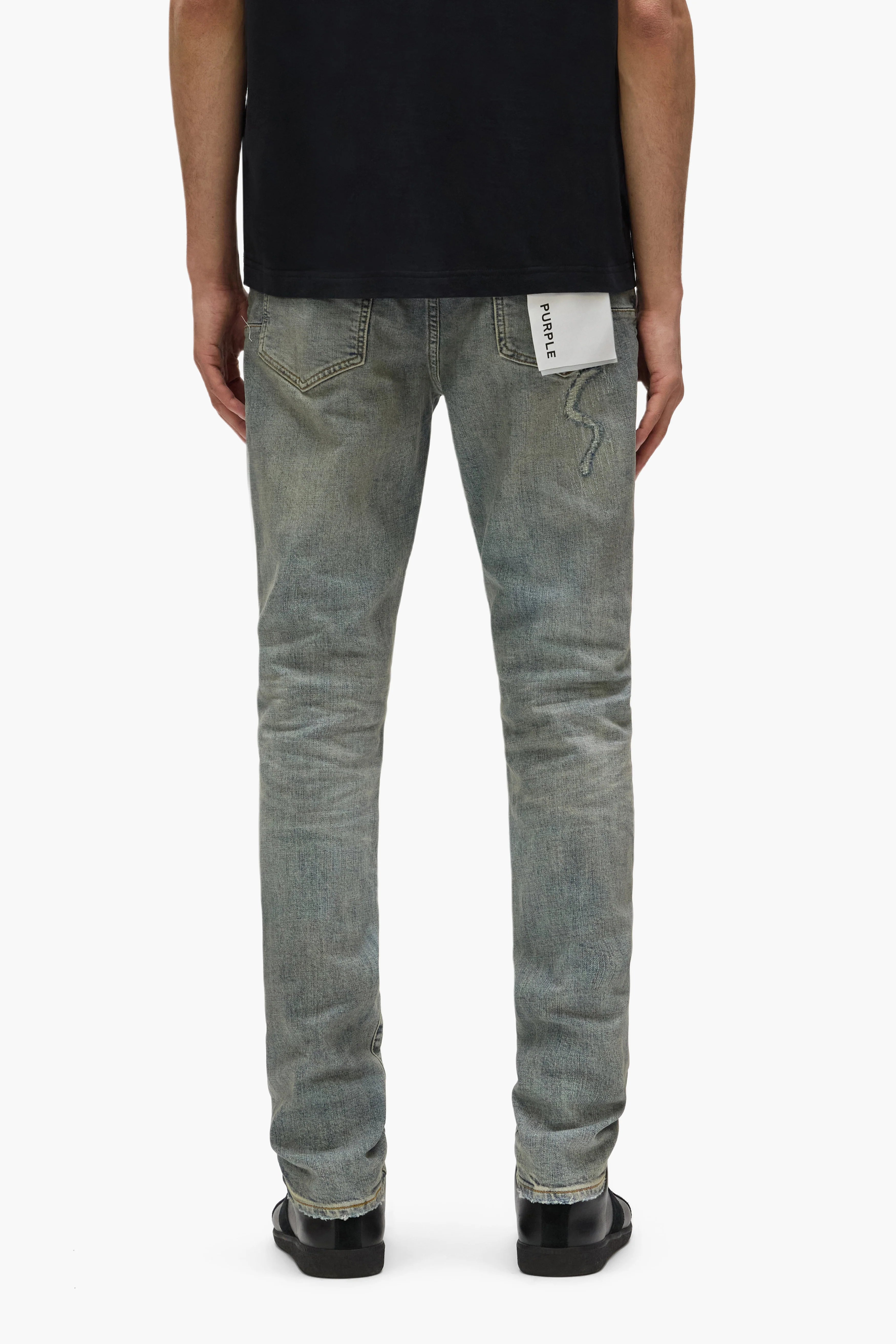 Purple Brand Core White Label Light Indigo skinny jeans with abrasions, repairs, hand-finished washes, and branded leather patch, featuring reinforced stitching and a low-rise fit.