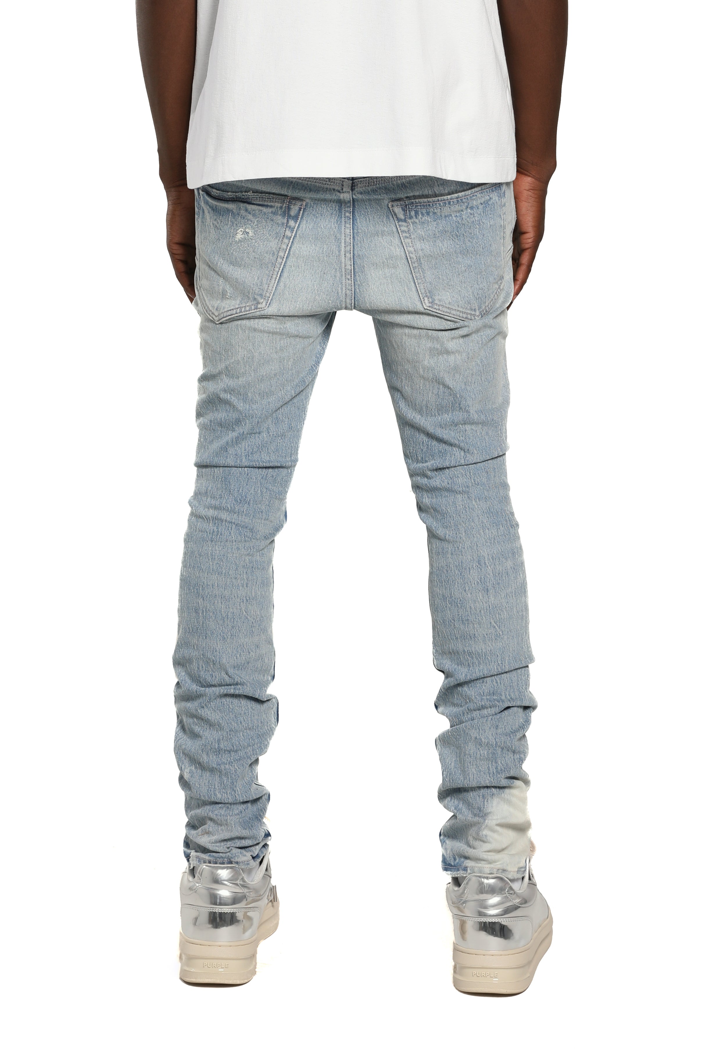 Purple Brand P001 Repairs Light Indigo stretch skinny jeans with low rise, reinforced pockets, back pocket detailing, and hand-finished washes