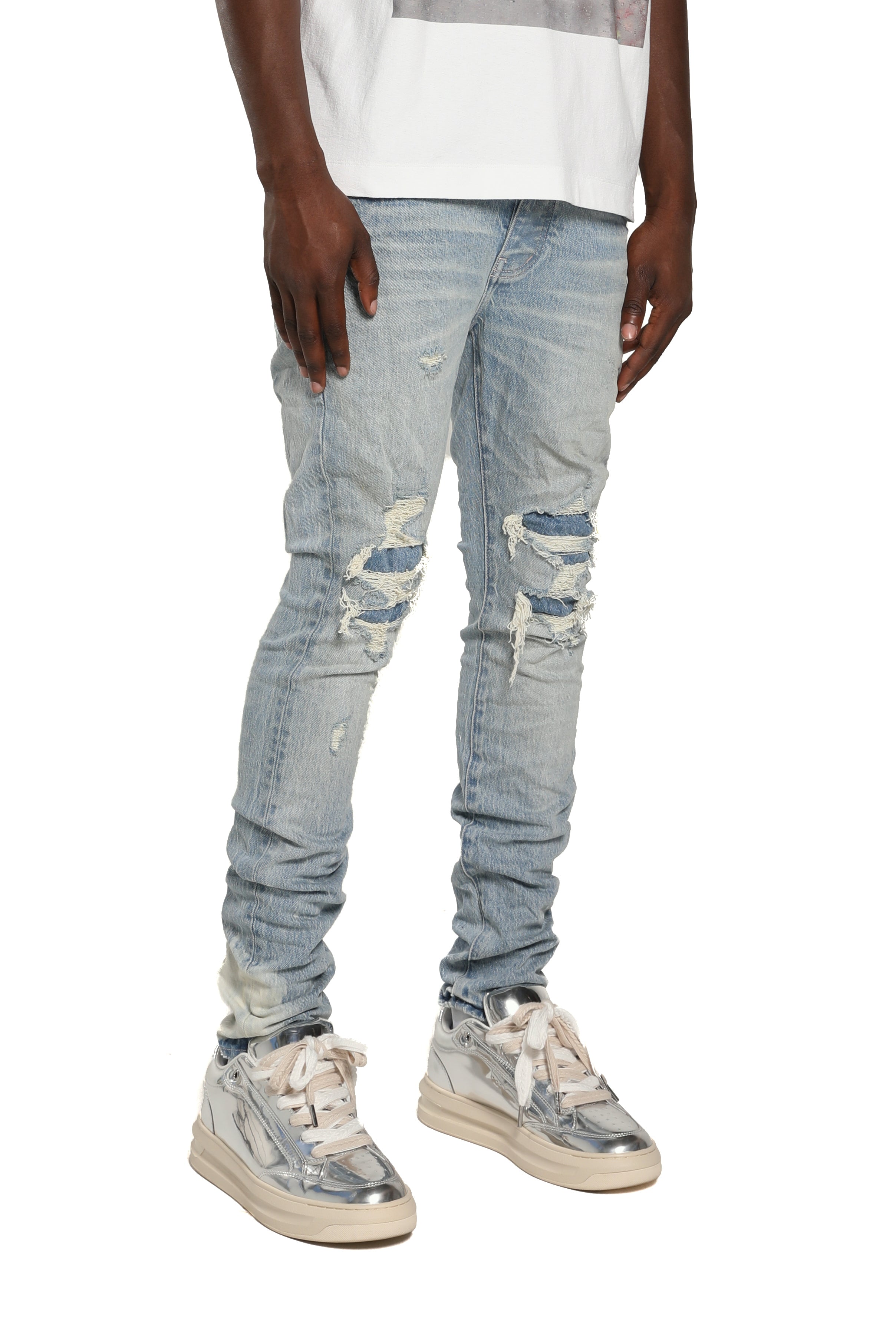 Purple Brand P001 Repairs Light Indigo stretch skinny jeans with low rise, reinforced pockets, back pocket detailing, and hand-finished washes