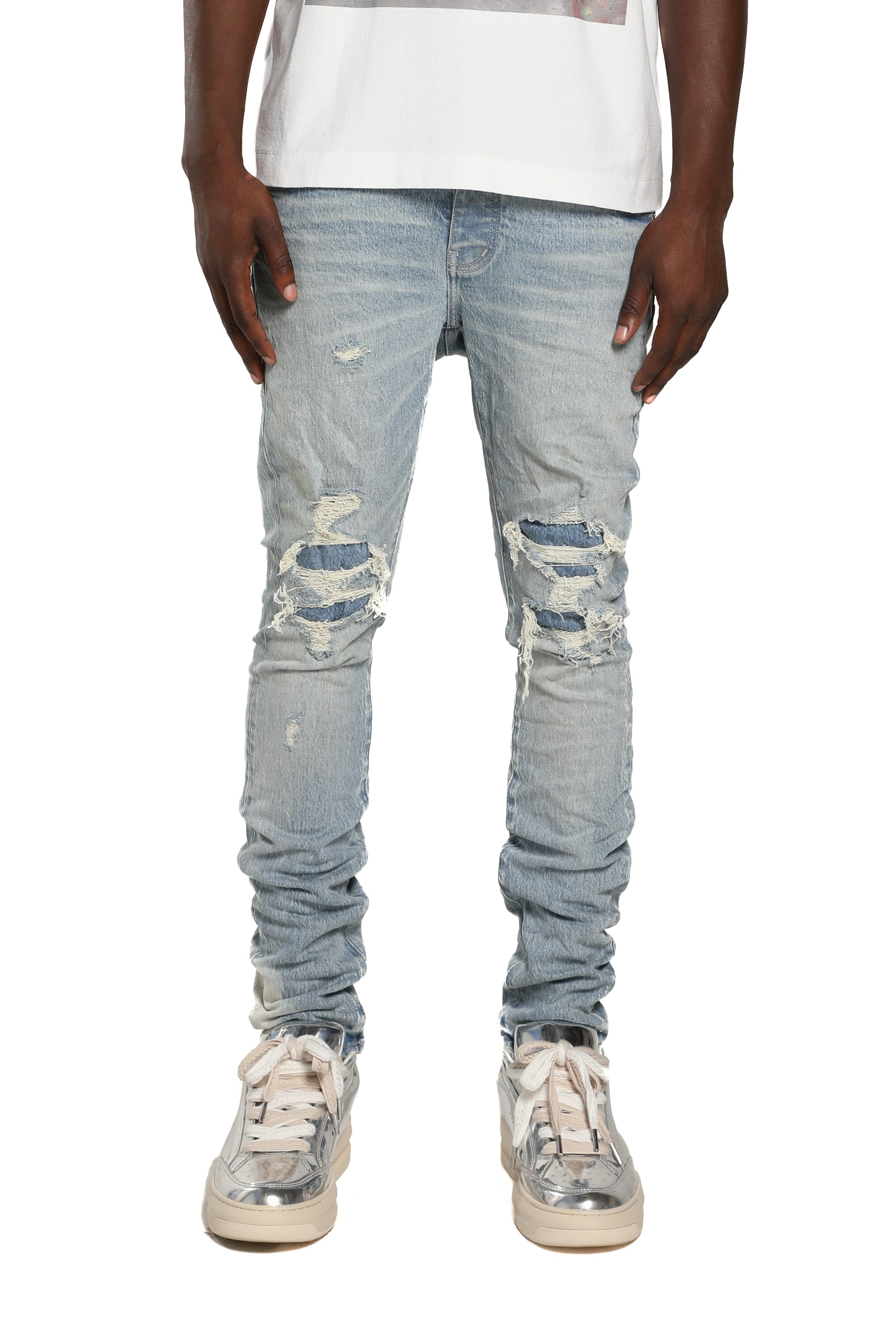 Purple Brand P001 Repairs Light Indigo stretch skinny jeans with low rise, reinforced pockets, back pocket detailing, and hand-finished washes