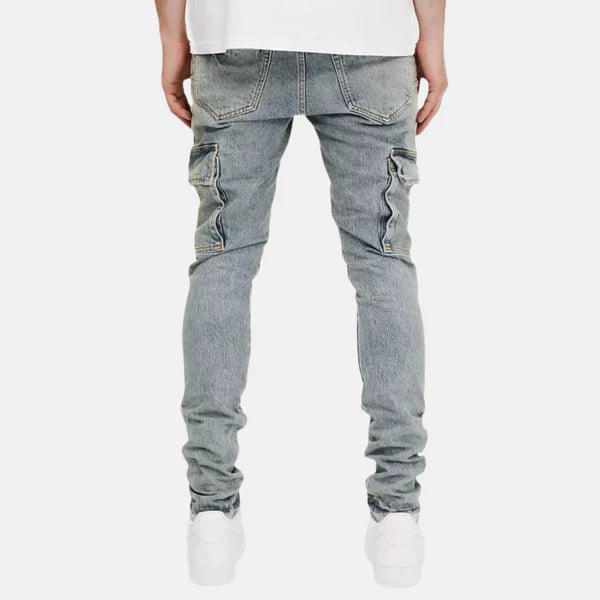 Purple Brand Skinny Cargo Jeans – Blue Stone Wash

These skinny cargo jeans from Purple Brand feature a sleek, modern fit with a blue stone wash for a rugged yet refined look. Crafted with durable fabric and a slim silhouette, they offer a stylish take on classic cargo style, complete with functional pockets for added utility. Perfect for everyday wear, these jeans combine practicality with fashion-forward design.

Key Features:

Skinny fit with a tapered leg

Classic cargo pockets for functionality

Blue s