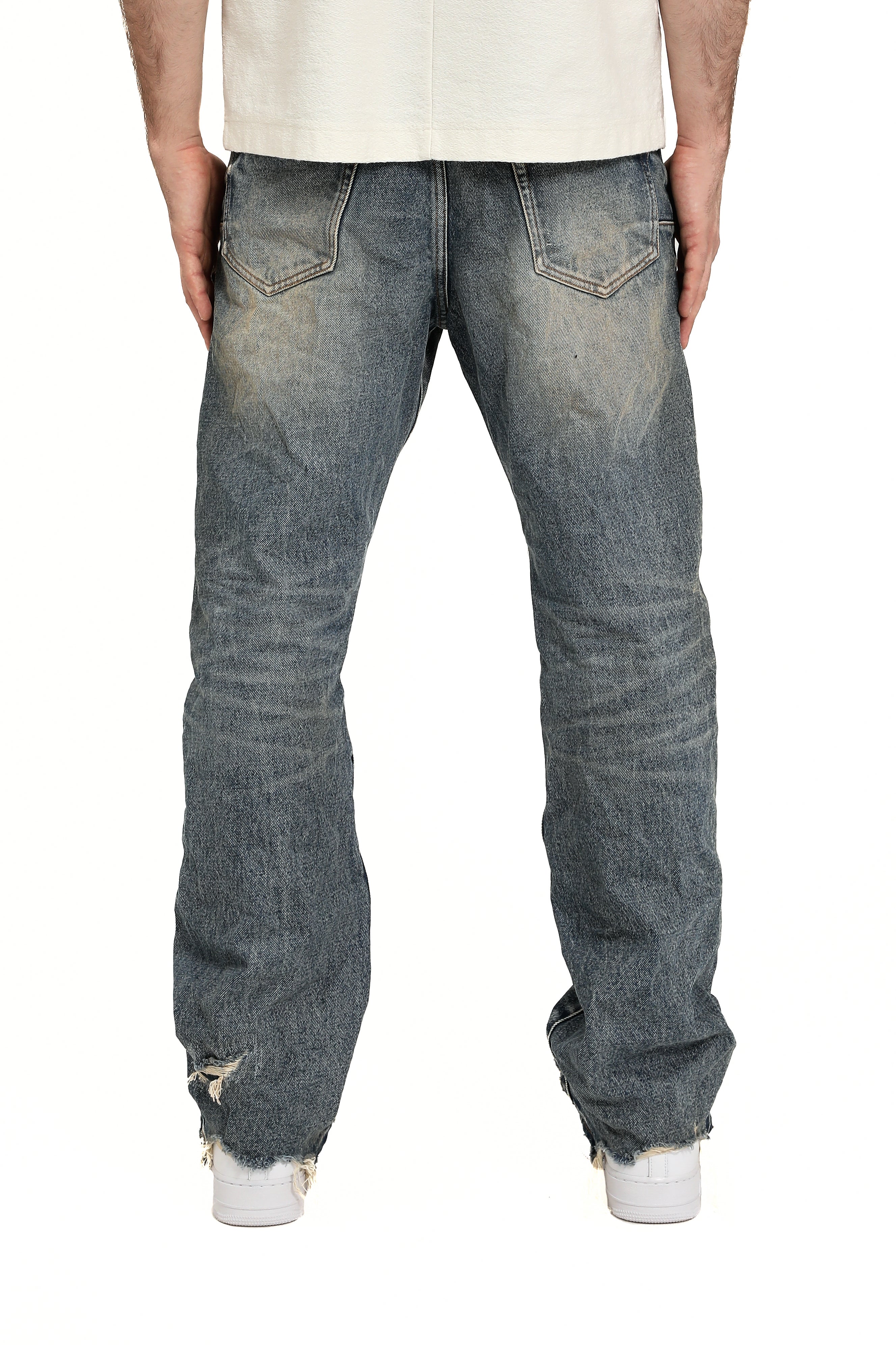 Purple Brand Skinny Monterrico Jeans in light indigo wash with fading, whiskering, and a skinny tapered fit.