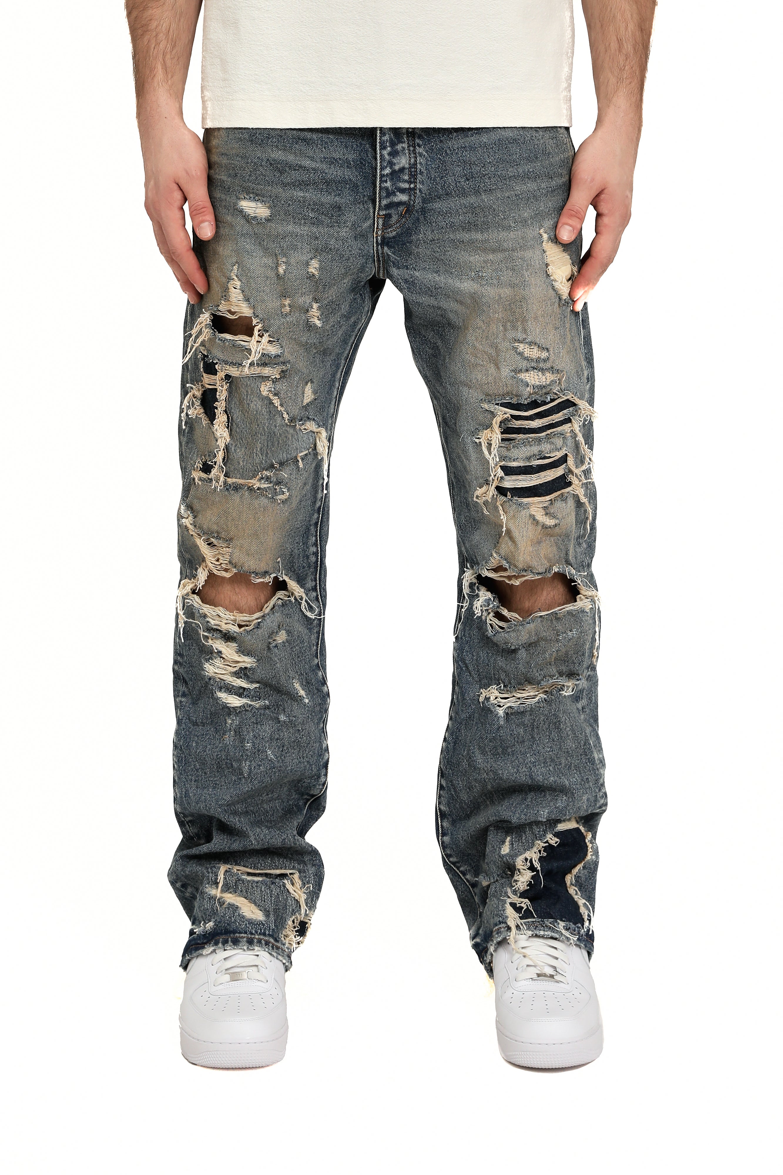 Purple Brand Skinny Monterrico Jeans in light indigo wash with fading, whiskering, and a skinny tapered fit.