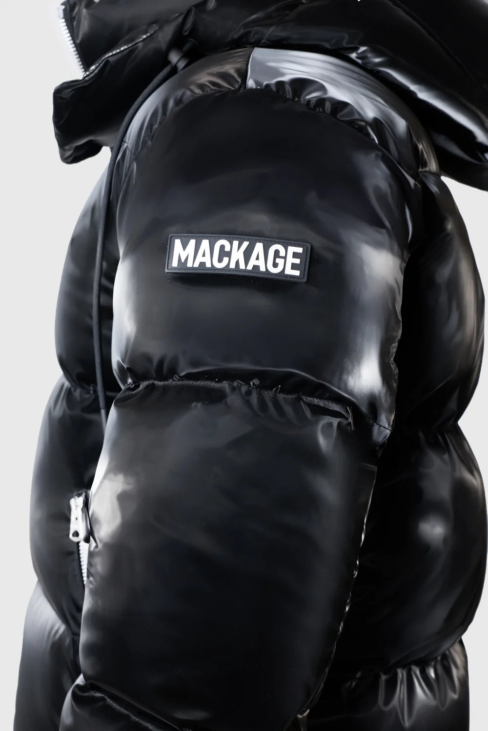 Mackage KENT-GLO high-gloss down jacket with removable hood, insulated pockets, and rib knit storm cuffs.