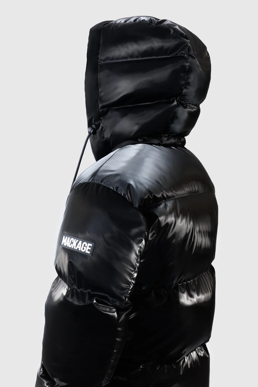 Mackage KENT-GLO high-gloss down jacket with removable hood, insulated pockets, and rib knit storm cuffs.