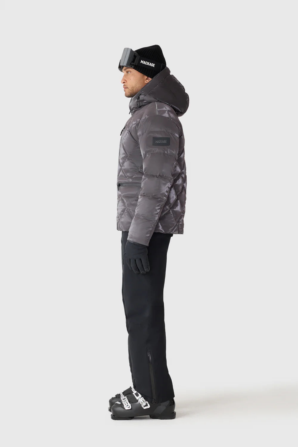 Mackage CILLIAN-GLO high-gloss quilted ski jacket with removable hood, powder skirt, and recycled down insulation.