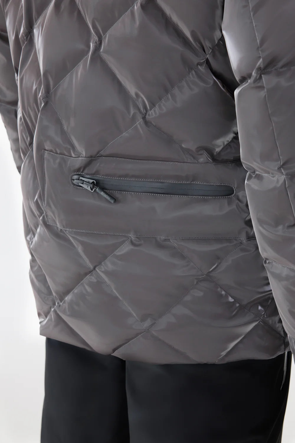 Mackage CILLIAN-GLO high-gloss quilted ski jacket with removable hood, powder skirt, and recycled down insulation.