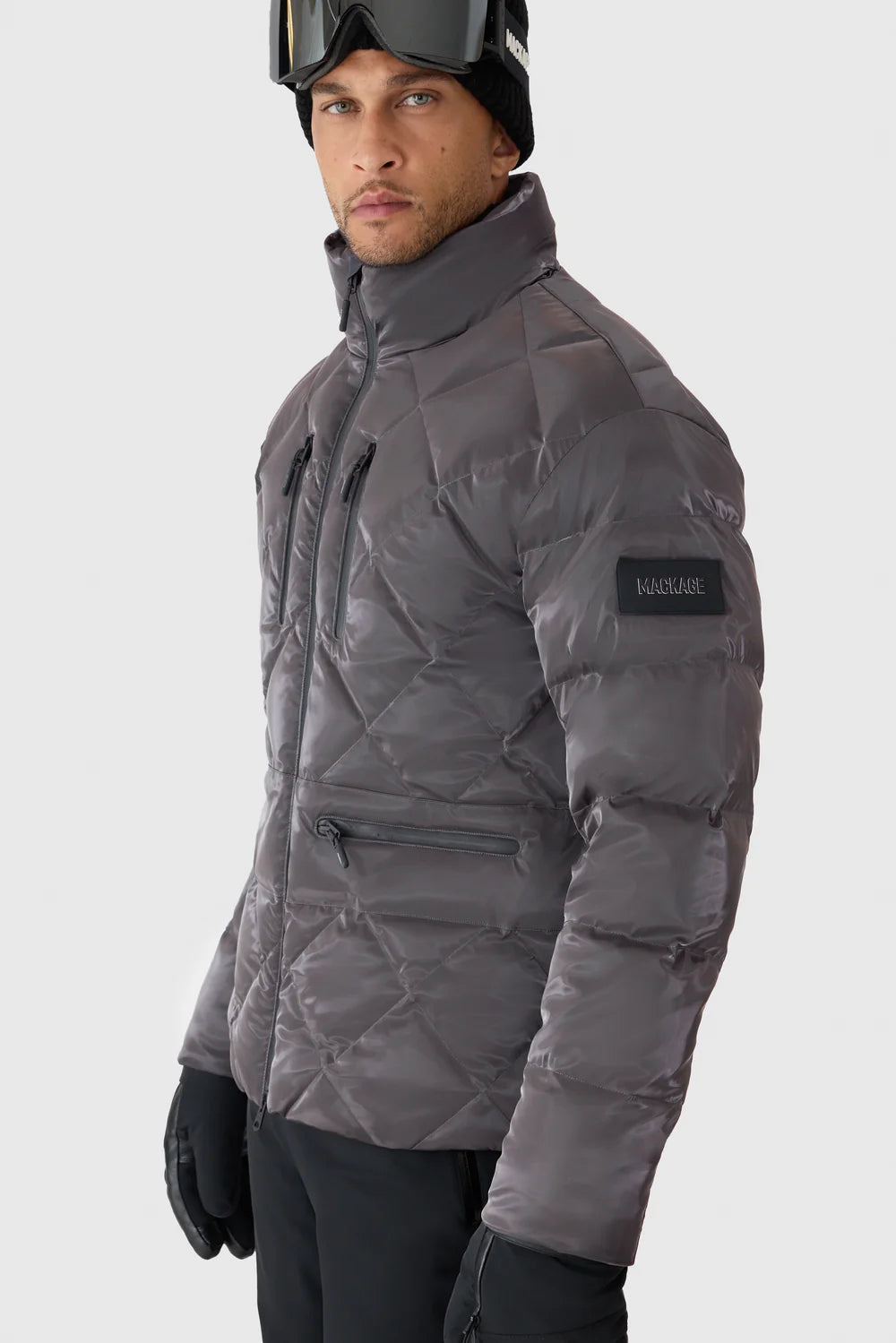 Mackage CILLIAN-GLO high-gloss quilted ski jacket with removable hood, powder skirt, and recycled down insulation.