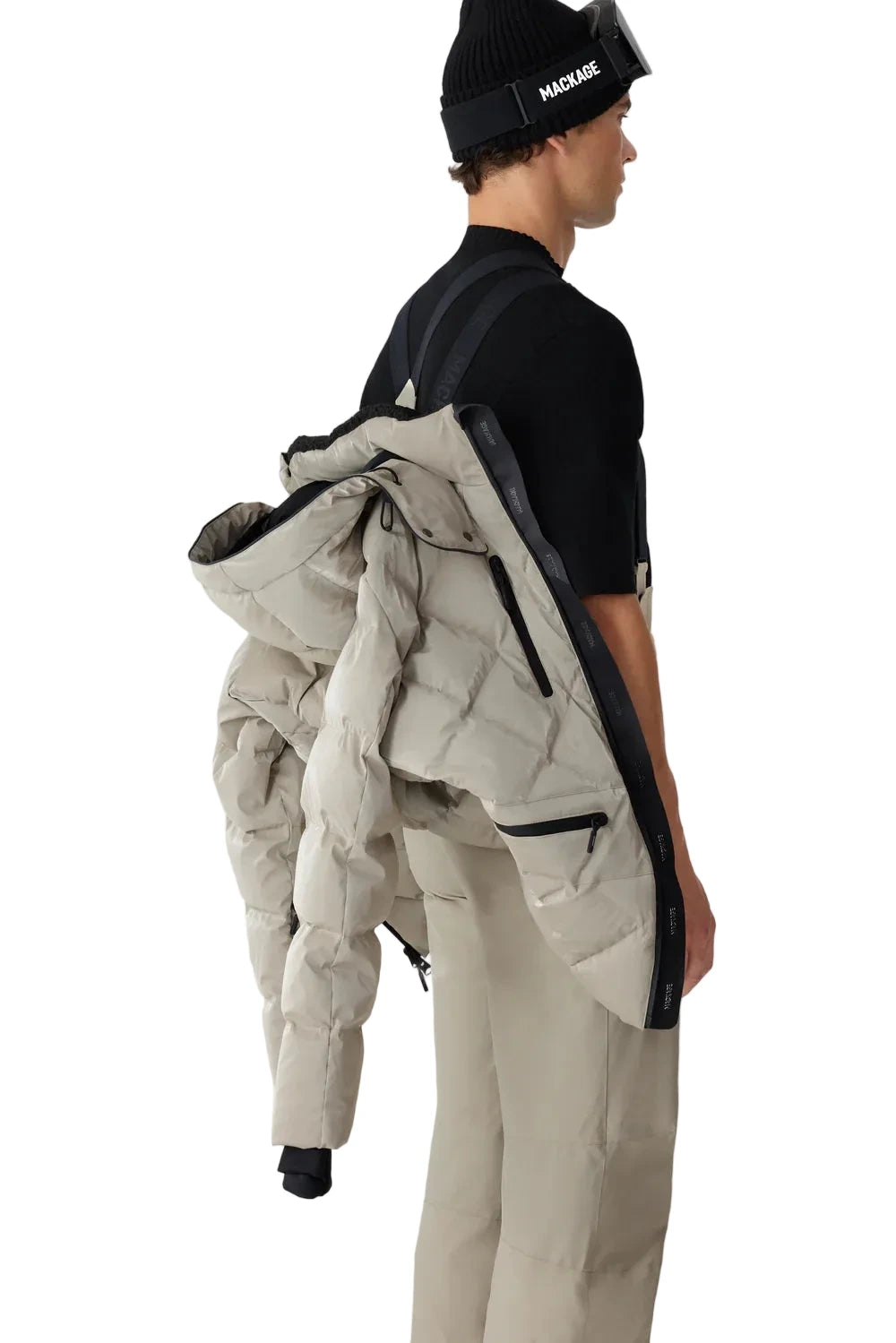 Mackage CILLIAN-GLO high-gloss quilted ski jacket with removable storm hood, powder skirt, and multiple utility pockets.