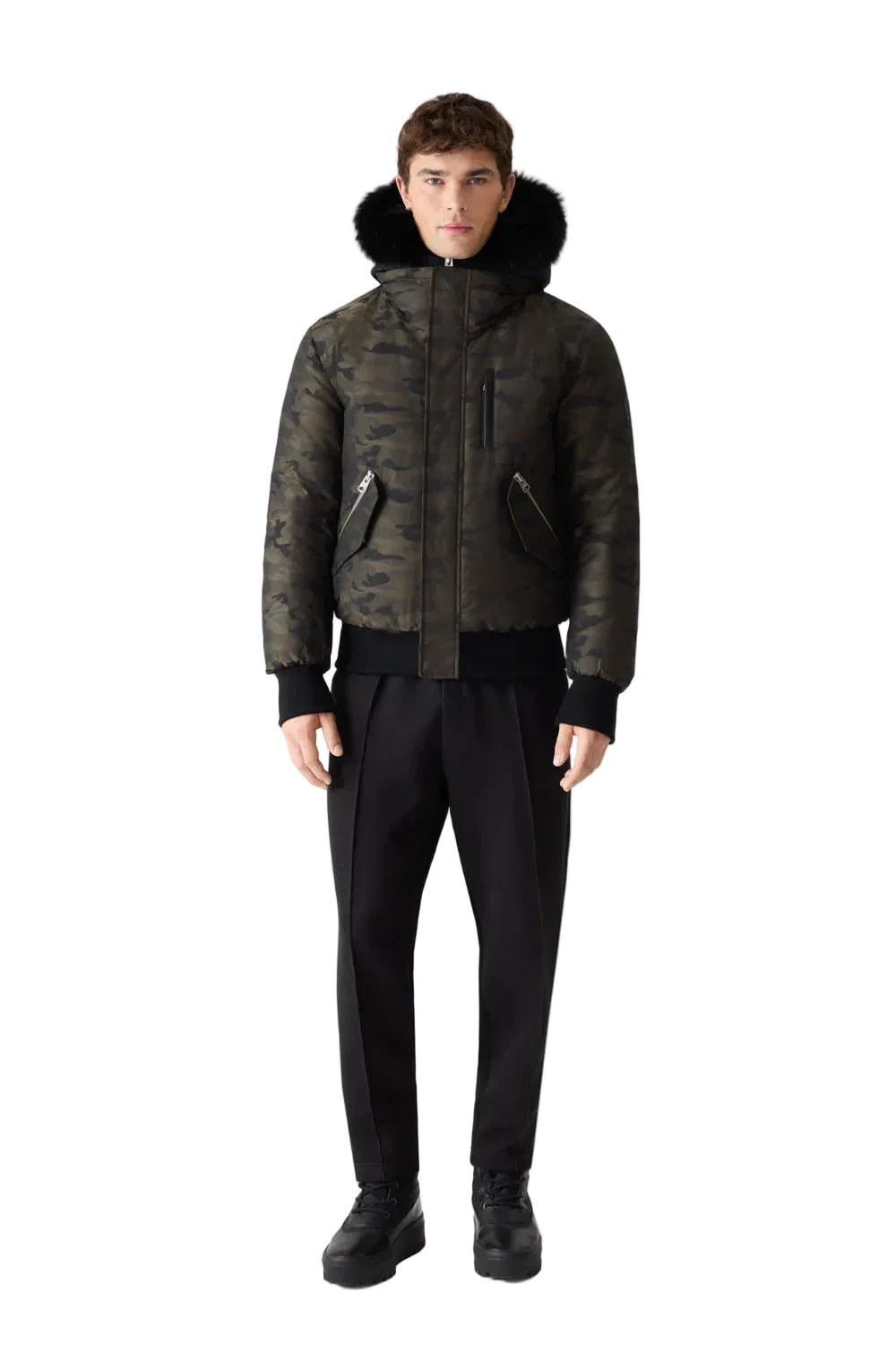 Mackage DIXON-JCZ down-filled bomber jacket with removable bib, fur-trimmed hood, and jacquard camouflage pattern.