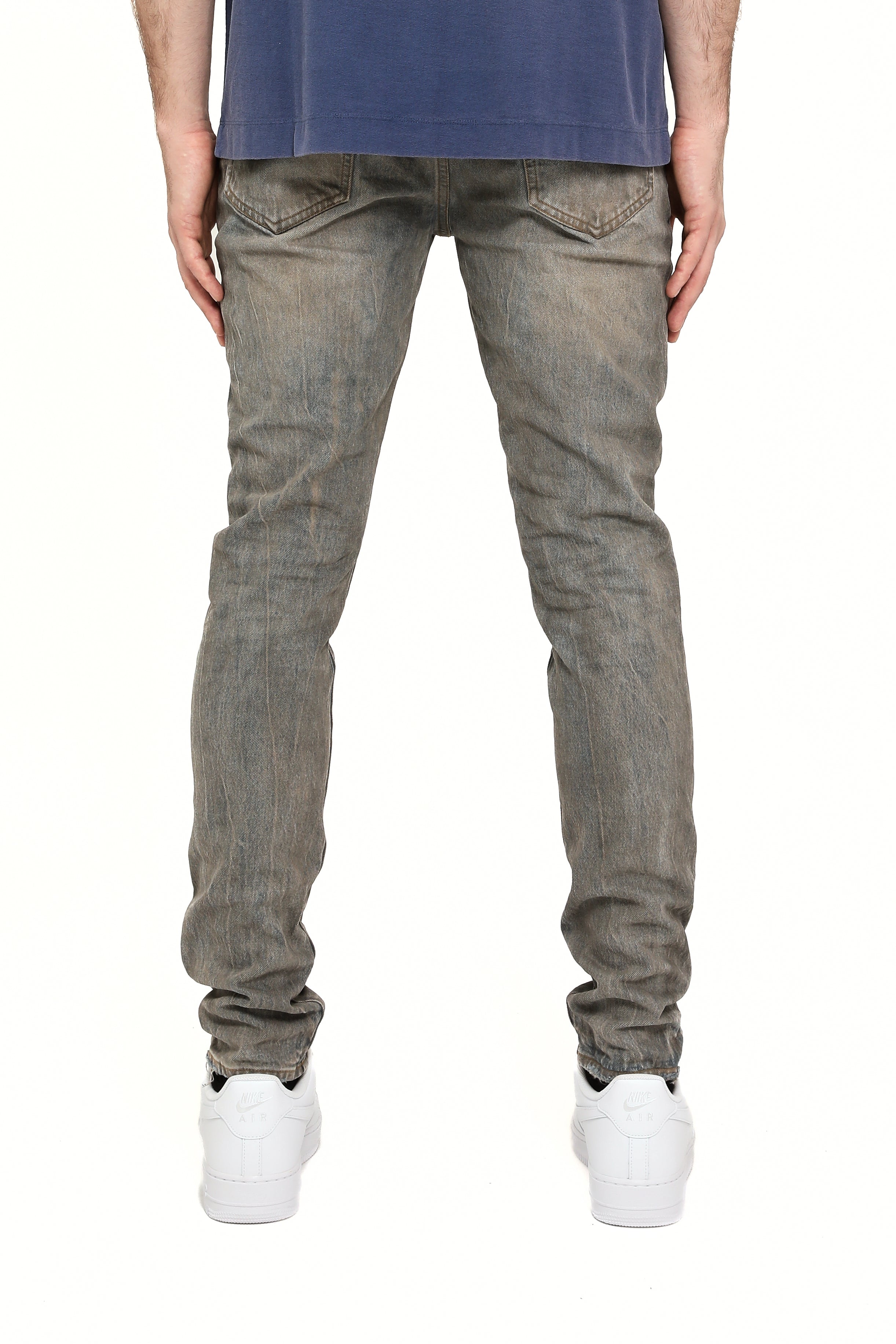 Purple Brand Repair Blowout Jeans in mid indigo wash with distressed blowout details, repaired accents, and slim tapered fit.