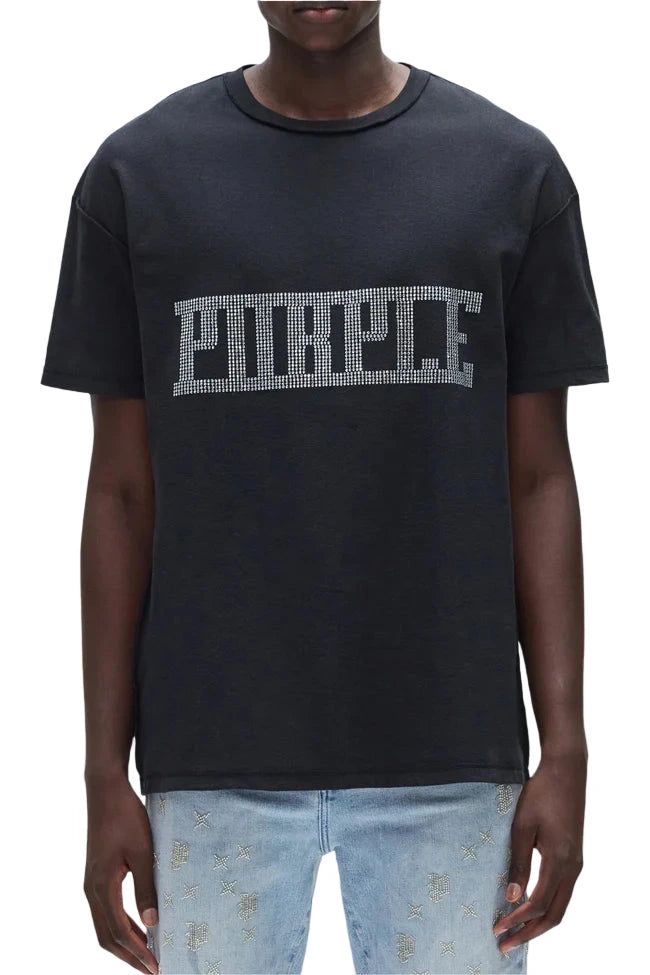 Black t-shirt with 'Purple' text worn by a person on a white background