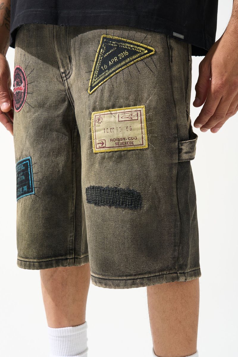 SERENEDE PASSPORT denim shorts in a deep charcoal wash with an earthy tint, premium structured denim, vintage-inspired details, and signature branded hardware.