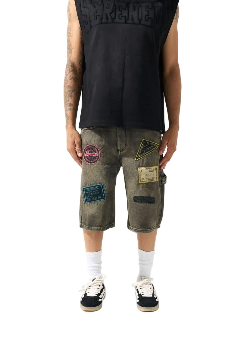 SERENEDE PASSPORT denim shorts in a deep charcoal wash with an earthy tint, premium structured denim, vintage-inspired details, and signature branded hardware.