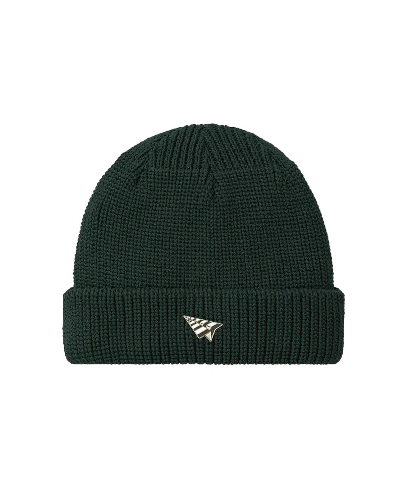 Paper Plane Wharfman beanie with rolled cuff, removable flag logo pin, and back flag label.