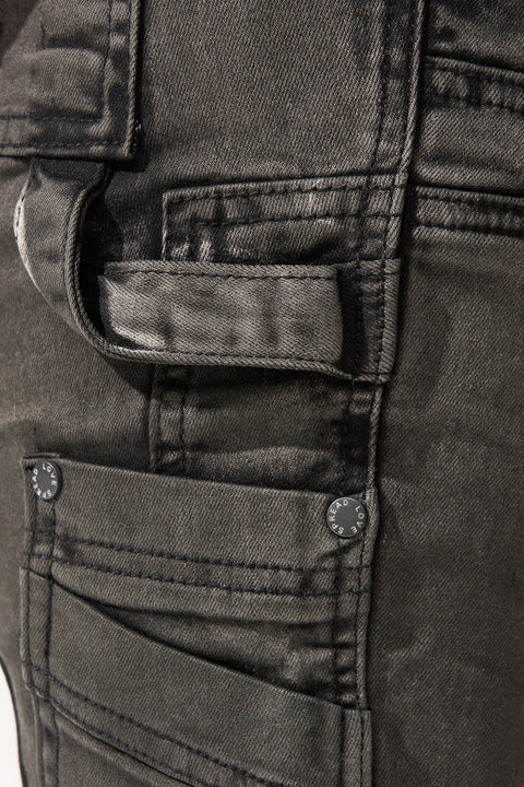 SERENEDE® RAIN smoke grey stacked jeans with carpenter panels, extended length, fitted silhouette, leather waistband patch, and branded hardware.