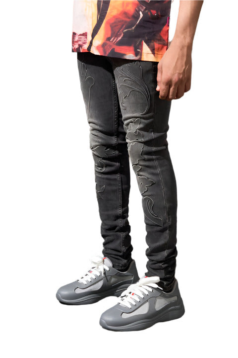 Vintage black SERENEDE® ROME jeans with debossed grape vine details, fading, and clean fitted construction.