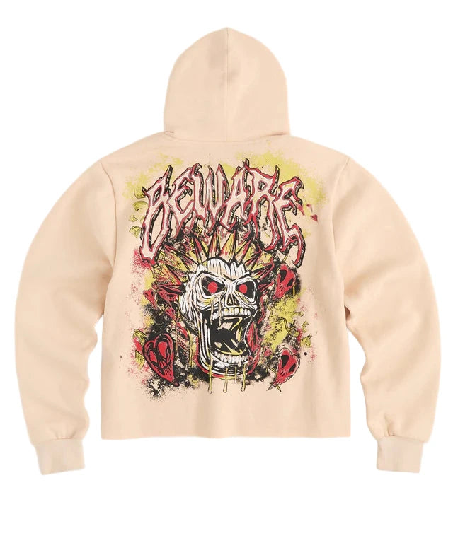 Khaki hoodie with embroidered skull graphic and custom front and back prints.