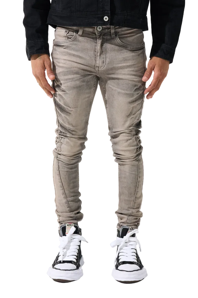 SERENEDE SANGROSE men's jeans in a vintage grey wash with rose pink accents, whiskering, side panels, and signature fitted denim construction.