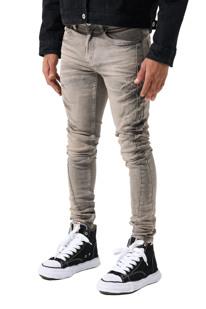 SERENEDE SANGROSE men's jeans in a vintage grey wash with rose pink accents, whiskering, side panels, and signature fitted denim construction.