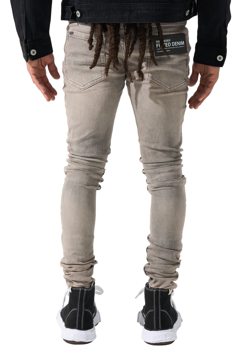 SERENEDE SANGROSE men's jeans in a vintage grey wash with rose pink accents, whiskering, side panels, and signature fitted denim construction.