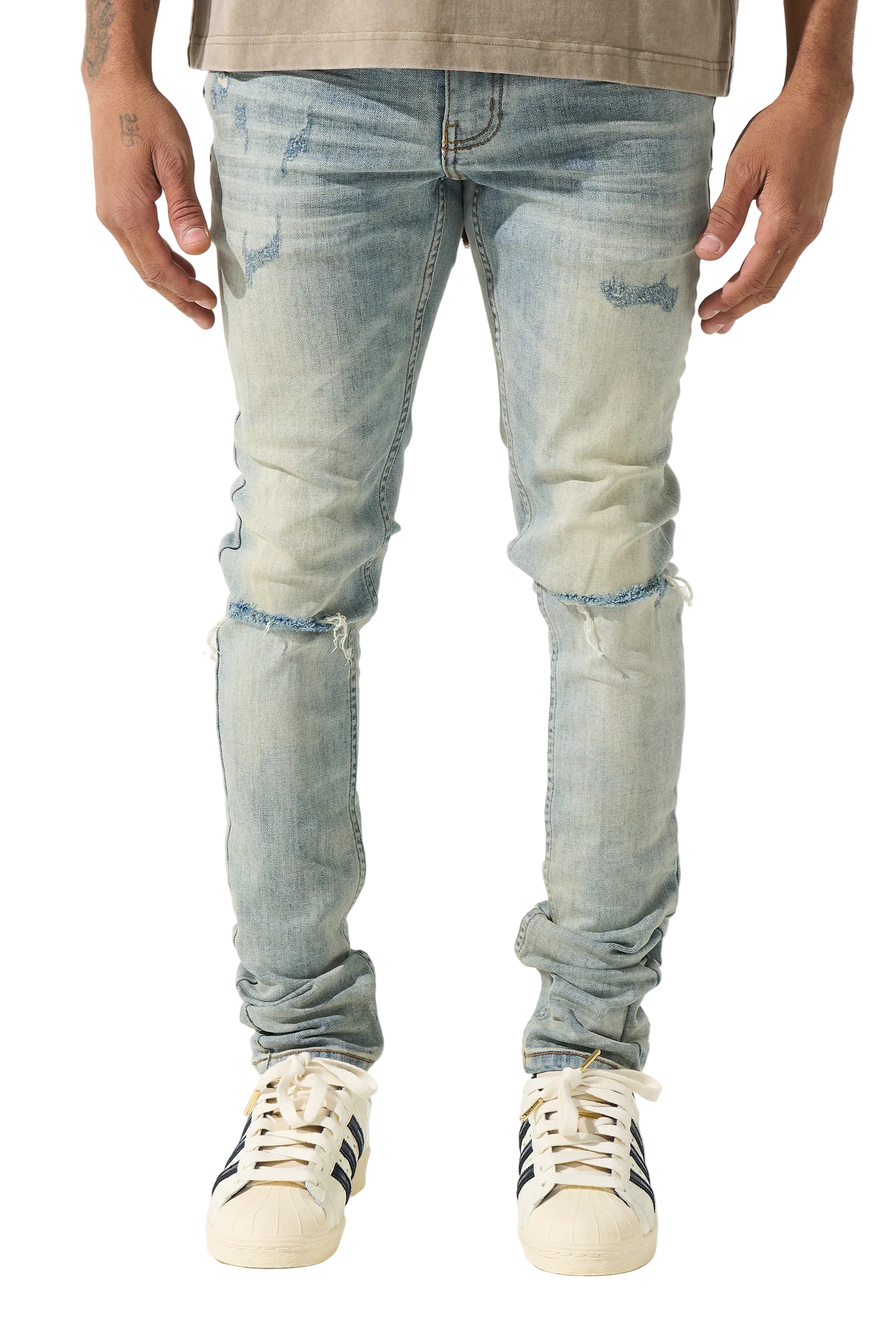 SERENEDE vintage earth wash skinny jeans with heavy fading, distressed details, and a tapered streetwear silhouette.