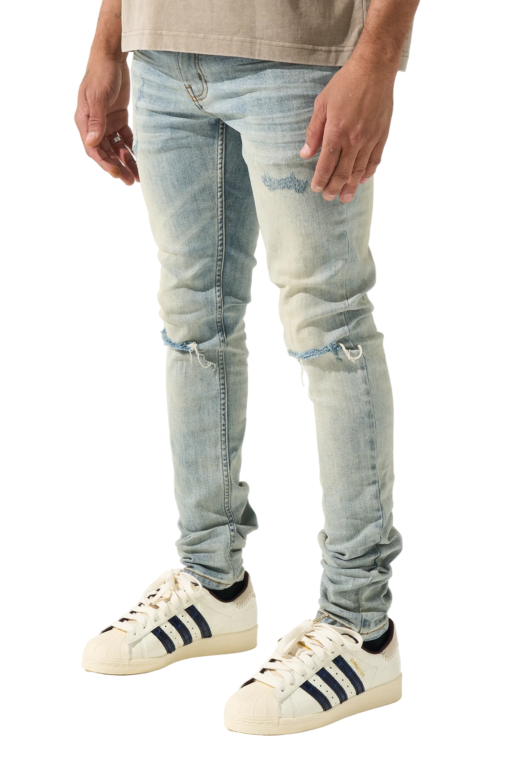 SERENEDE vintage earth wash skinny jeans with heavy fading, distressed details, and a tapered streetwear silhouette.