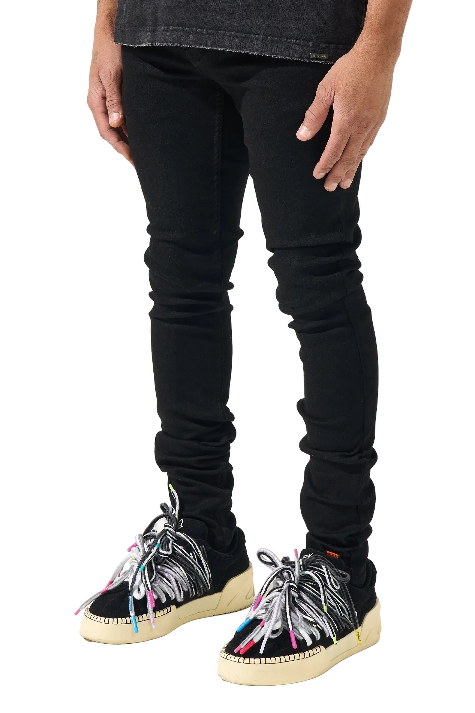 SERENEDE black stacked denim jeans with a slim fitted silhouette, stretch construction, and signature stacked ankle detailing.