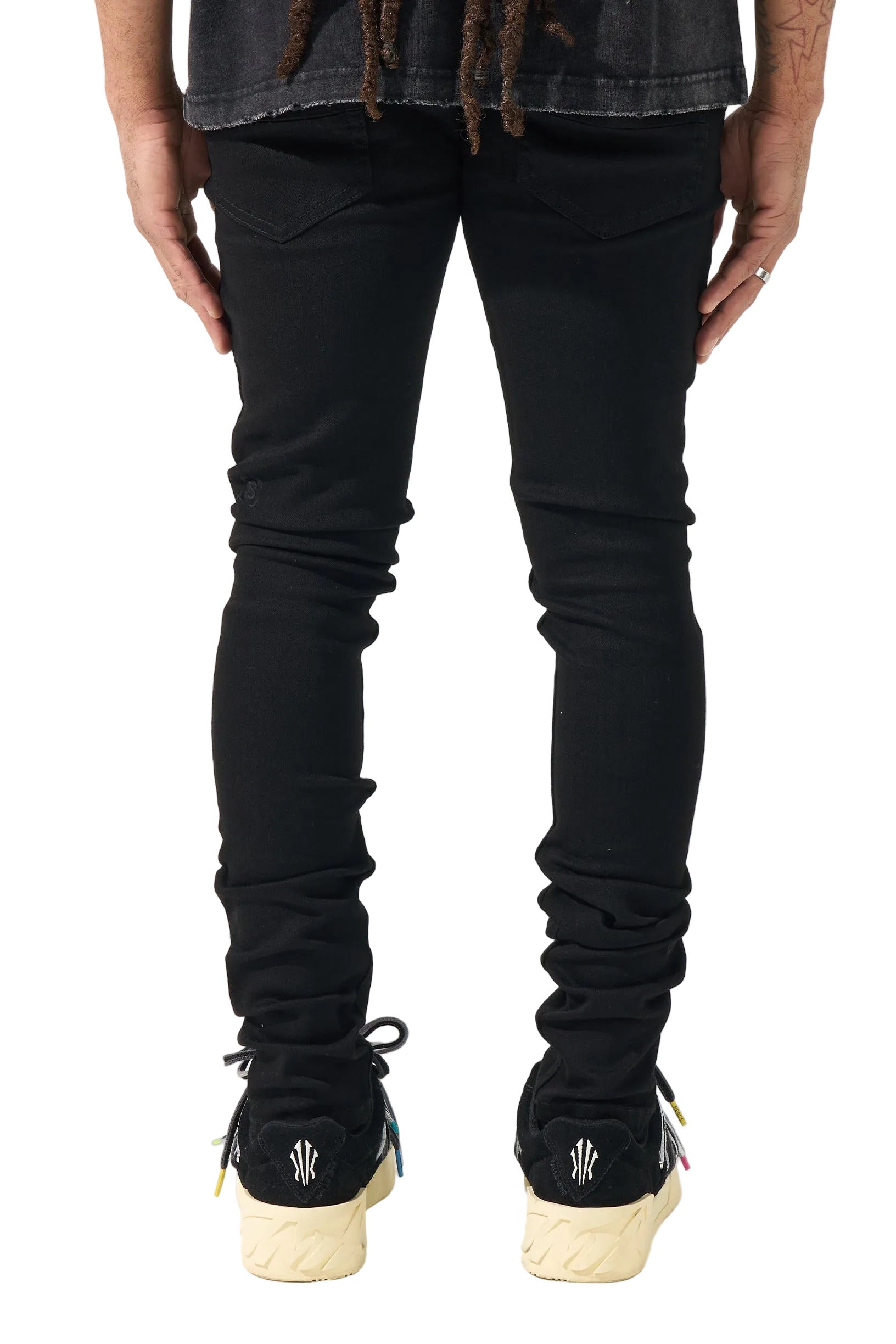 SERENEDE black stacked denim jeans with a slim fitted silhouette, stretch construction, and signature stacked ankle detailing.