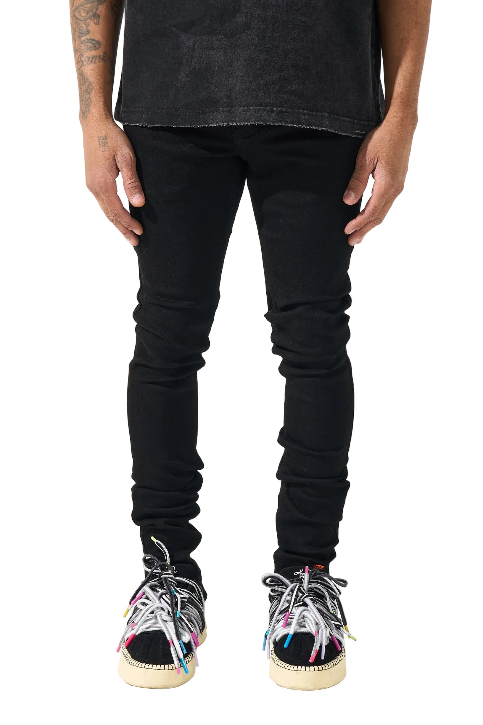 SERENEDE black stacked denim jeans with a slim fitted silhouette, stretch construction, and signature stacked ankle detailing.