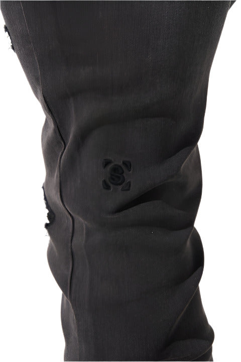 "SERENEDE® SHADOW33 skinny jeans in charcoal wash with tonal distressing and tapered ankle design.