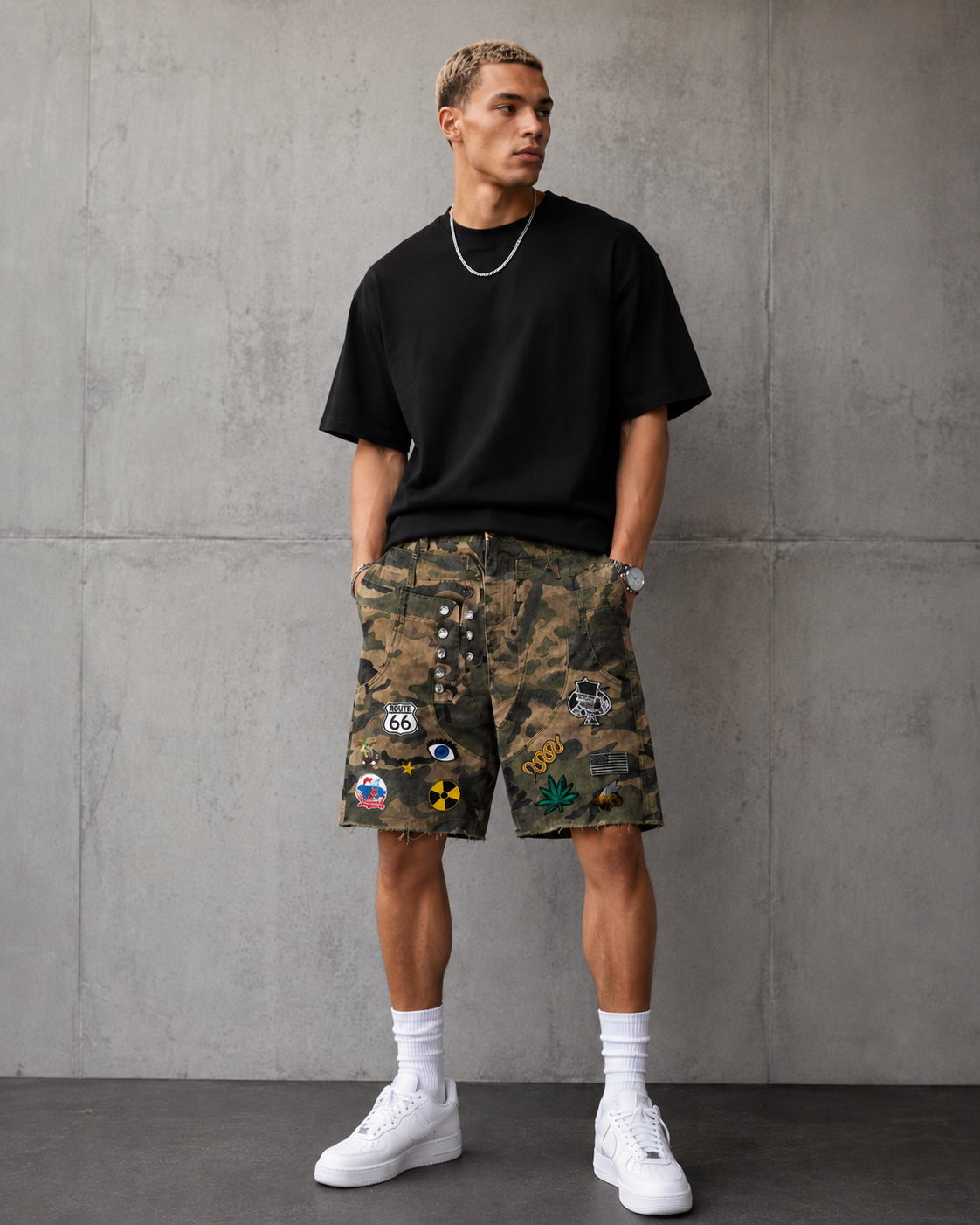 SPMIB Patch Shorts Green Camo by Sic Parvis Magna Infamous Brand limited edition camouflage denim shorts with embroidered patches, distressed raw hem, premium streetwear men's fashion.