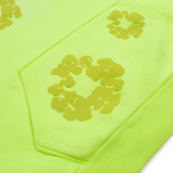 Denim Tears Mono Cotton Wreath Hoodie in neon green with sun-faded washed effect, regular fit, 100% cotton.