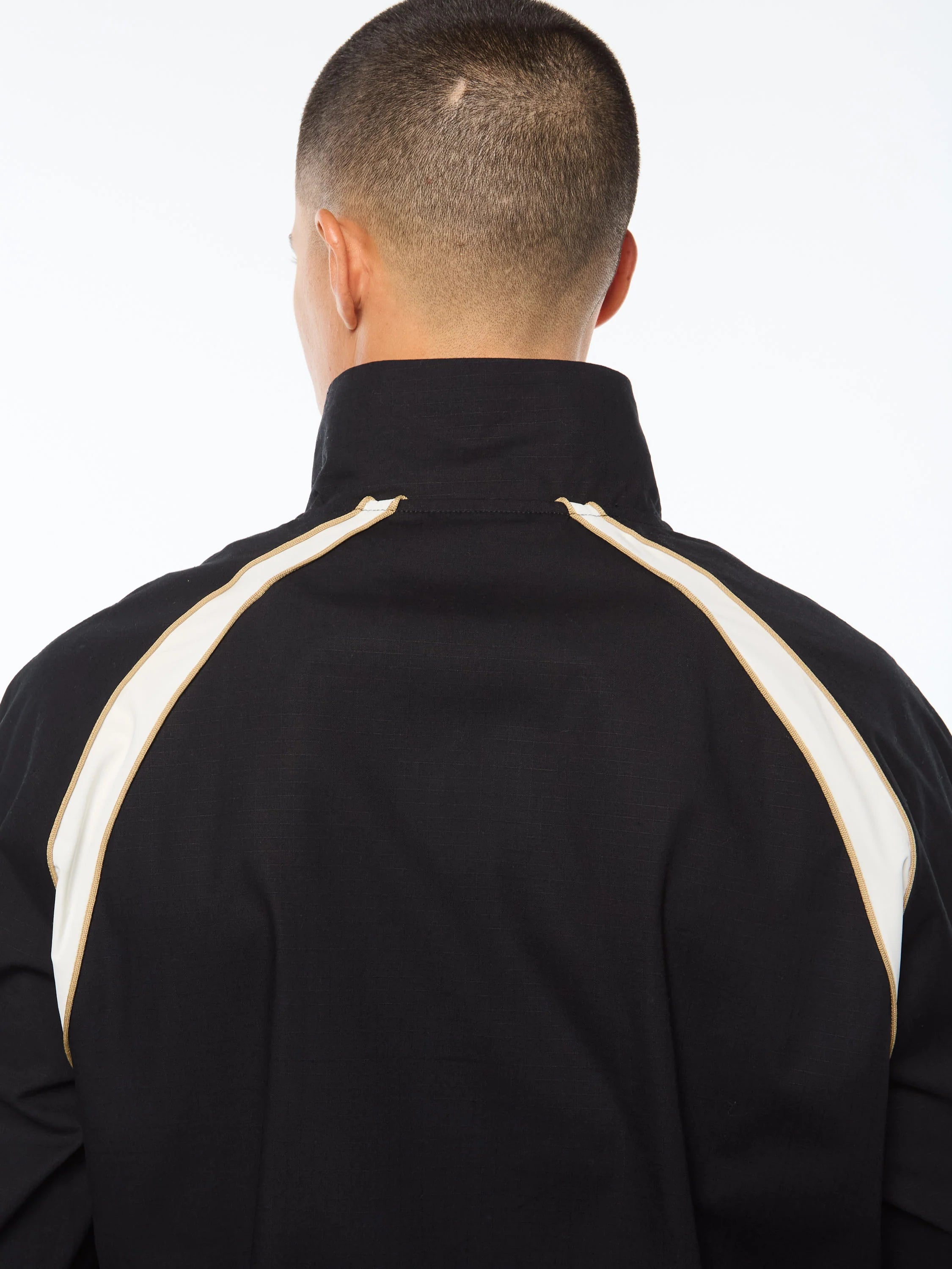 Premium track jacket with embroidered Sergio Tacchini logo, full-zip closure, contrast piping panels, and welt handwarmer pockets