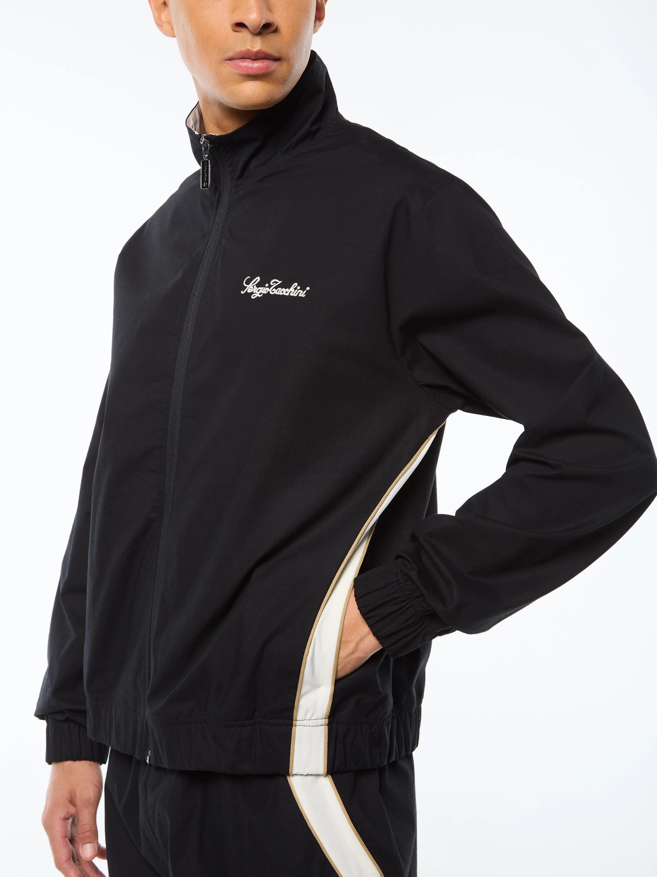 Premium track jacket with embroidered Sergio Tacchini logo, full-zip closure, contrast piping panels, and welt handwarmer pockets