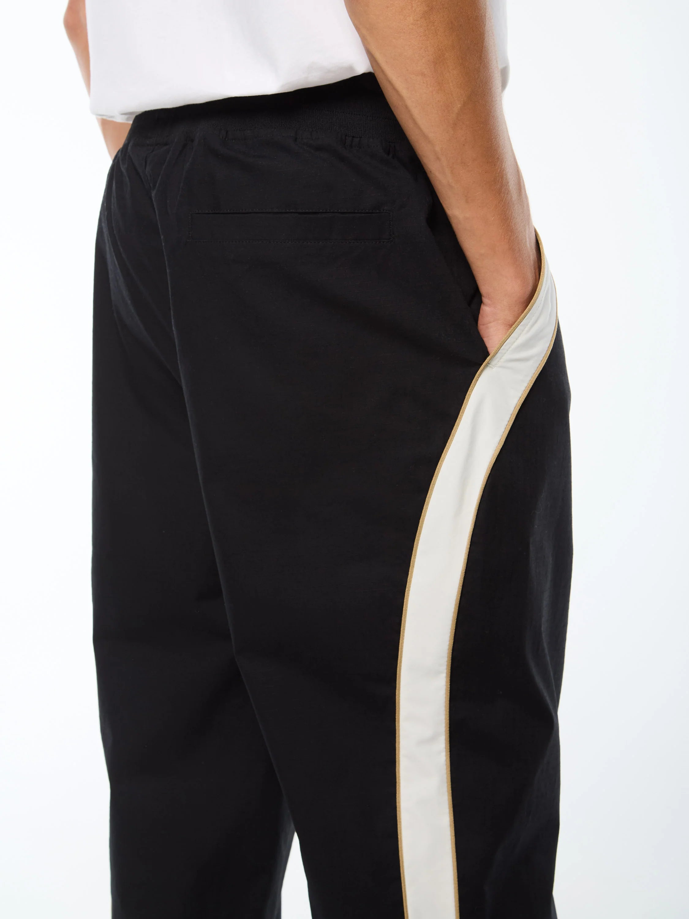 Premium track pants with embroidered Sergio Tacchini logo, elastic waistband, contrast piping down legs, and adjustable ankle zips