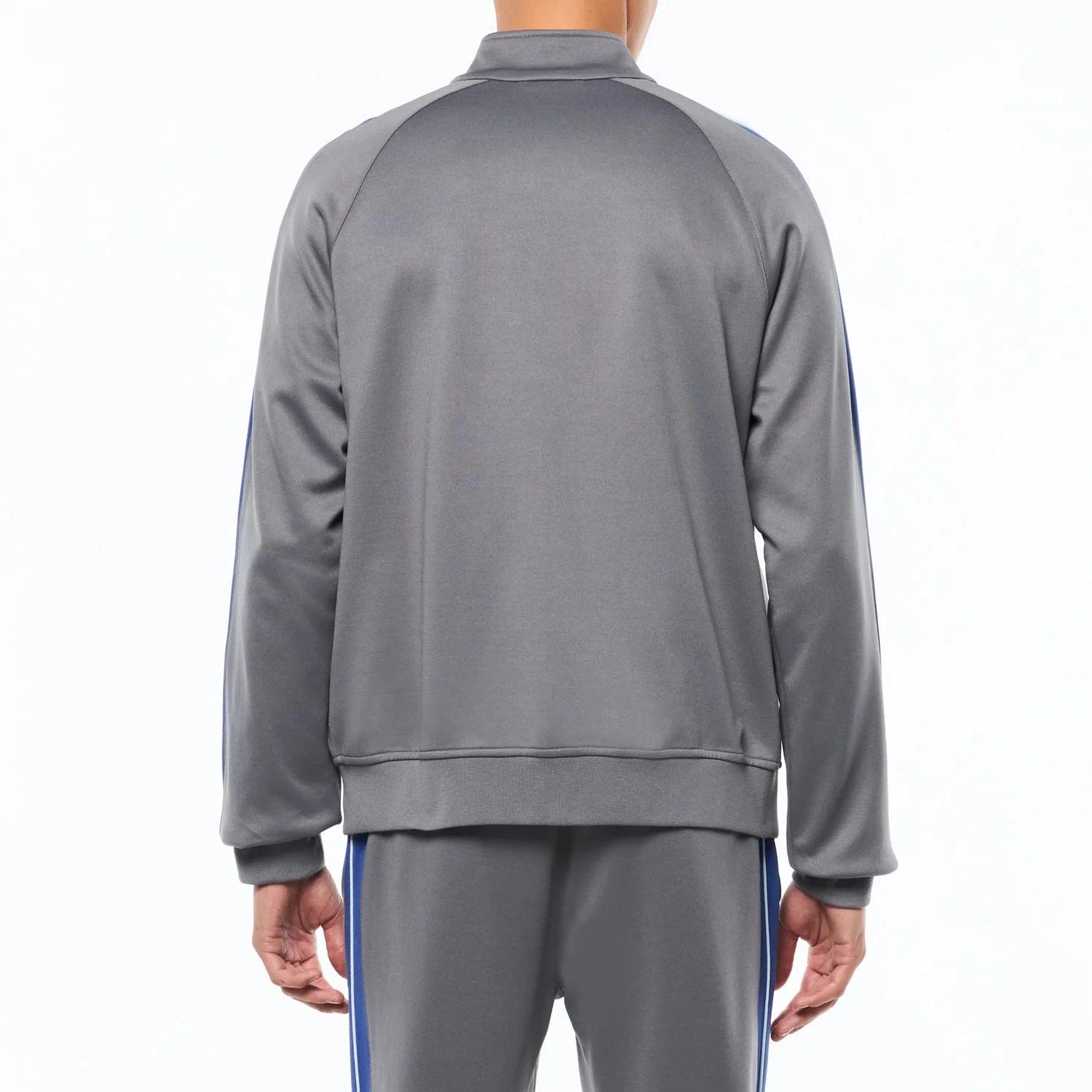 Premium track pants with elastic waistband, rear zippered welt pocket, embroidered Sergio Tacchini logo, contrast panels and piping, and adjustable ankle zips