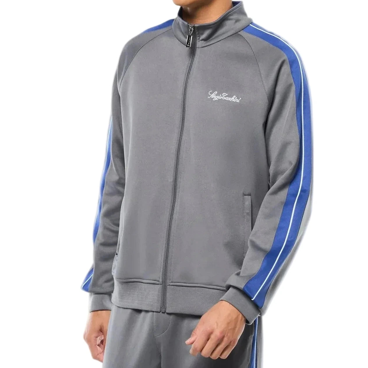 Premium track pants with elastic waistband, rear zippered welt pocket, embroidered Sergio Tacchini logo, contrast panels and piping, and adjustable ankle zips