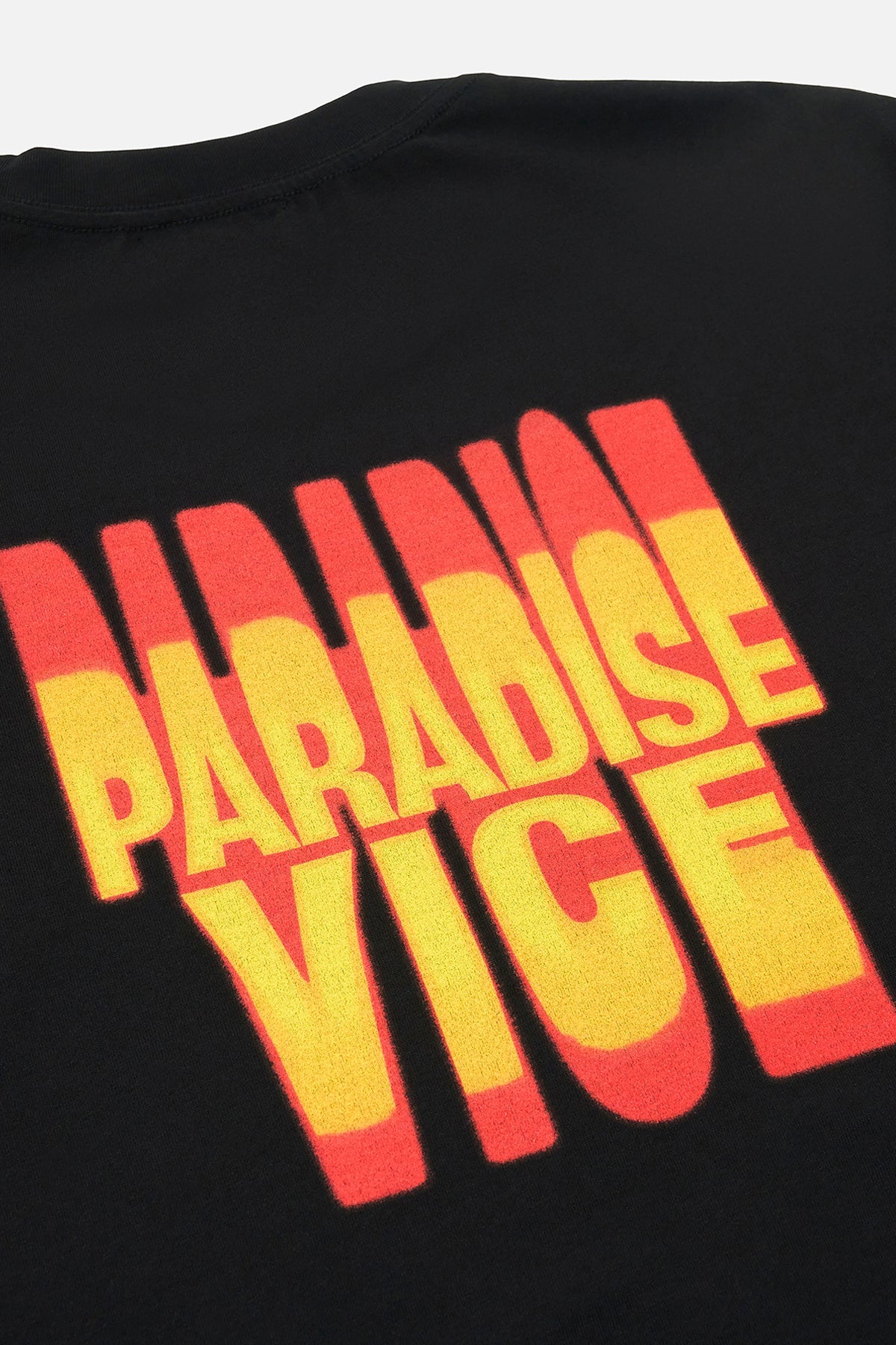 RTA Colin Oversized Short Sleeve Tee in black with large RTA logo on the chest and Paradise Vice gradient logo on the back, made from 100% cotton.