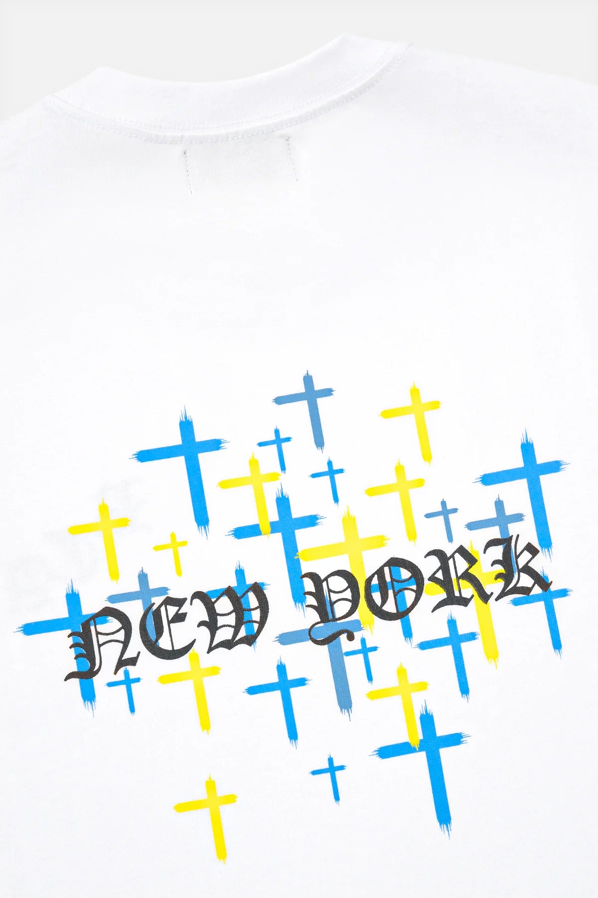 RtA Colin Oversized Short Sleeve Tee in White with Old English logo on chest and New York cross motif on back