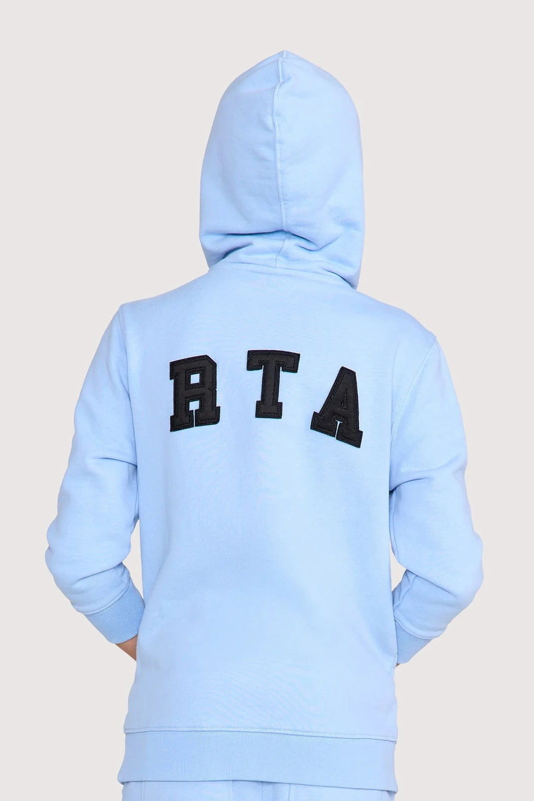 RtA Eden Hoodie in blue collegiate with collegiate-inspired logo patches and front kangaroo pocket.