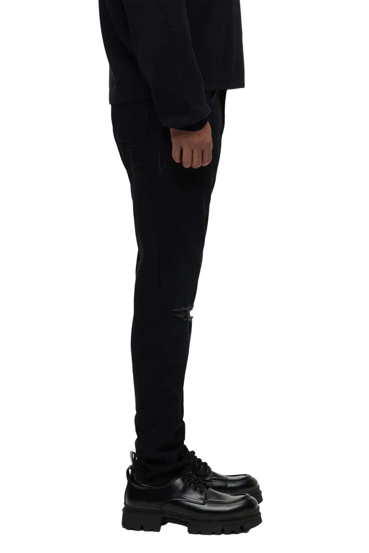 Hudson Zack Skinny Jeans in Destructed Ink black stretch denim with distressed detailing, knee destruction, and a modern slim silhouette.