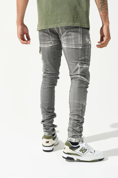 "SERENEDE® TIBURON jeans with grey overspray on white base, carpenter-style design, and unique artistic finish."
