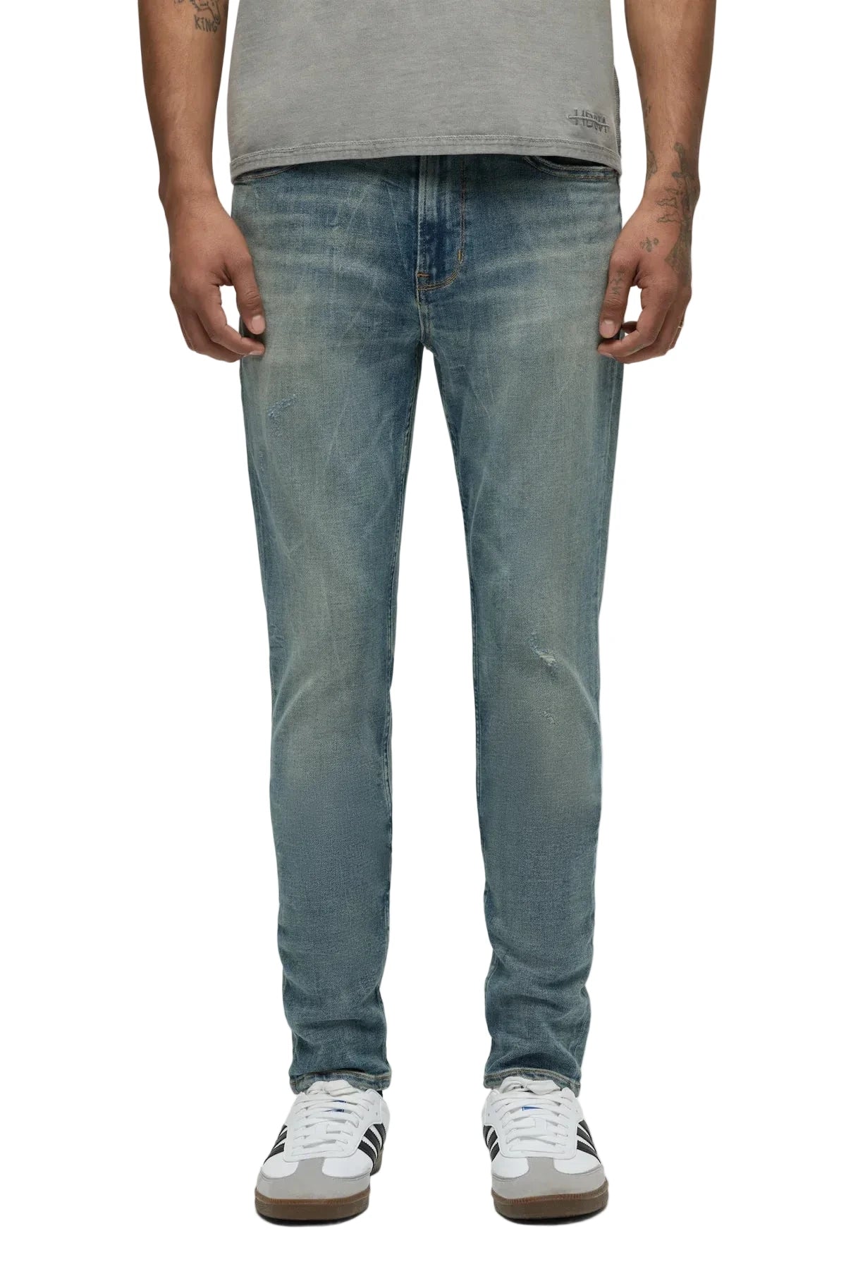 Hudson Zack Skinny Jeans in a light indigo vintage-inspired wash with subtle distressing, edge grinding, and a modern slim silhouette.
